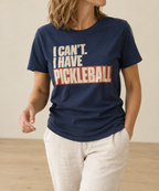 Navy t-shirt with a bold retro cream and terracotta print reading I Can't. I Have Pickleball.