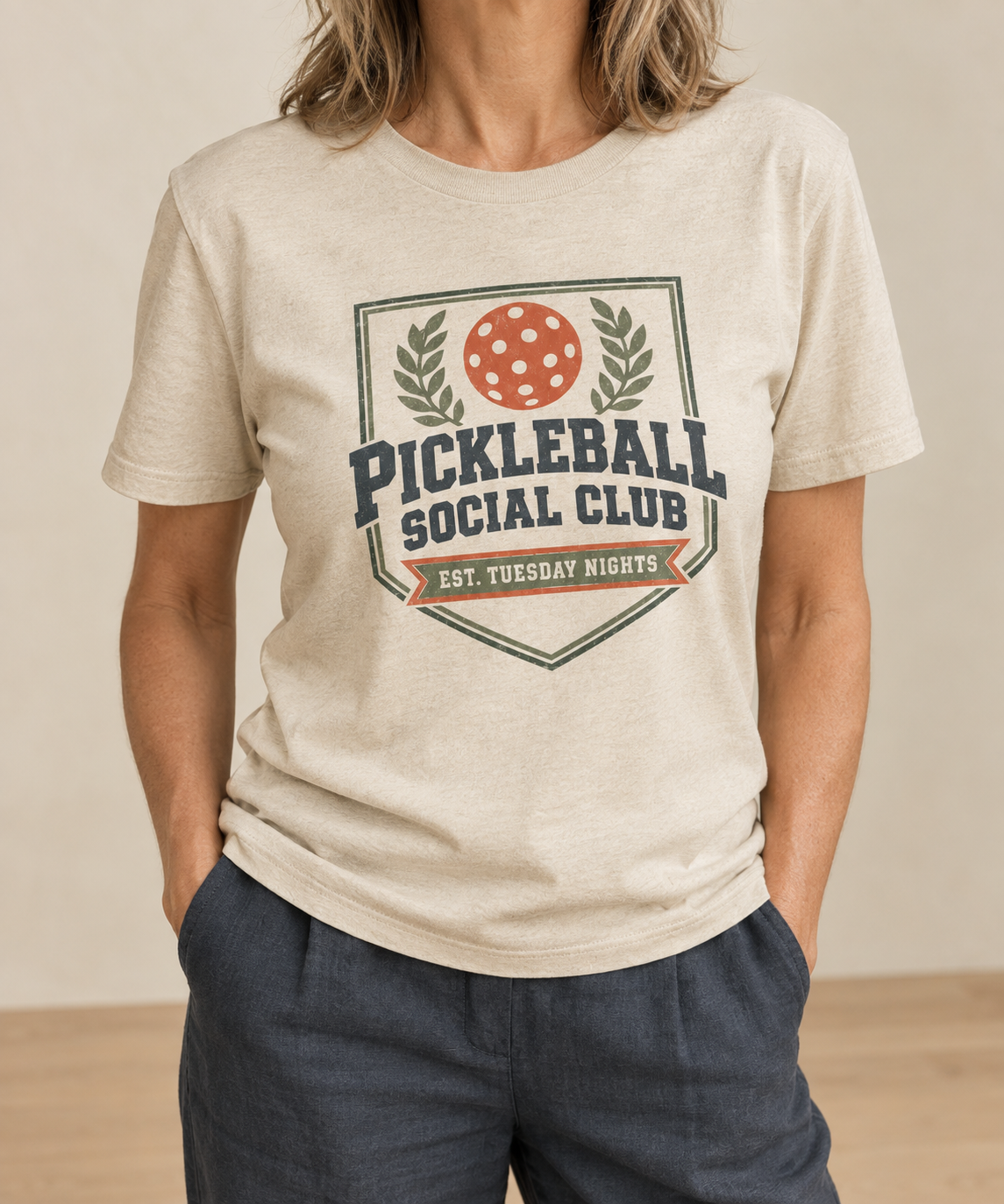 Natural cream t-shirt with a vintage Pickleball Social Club laurel crest badge